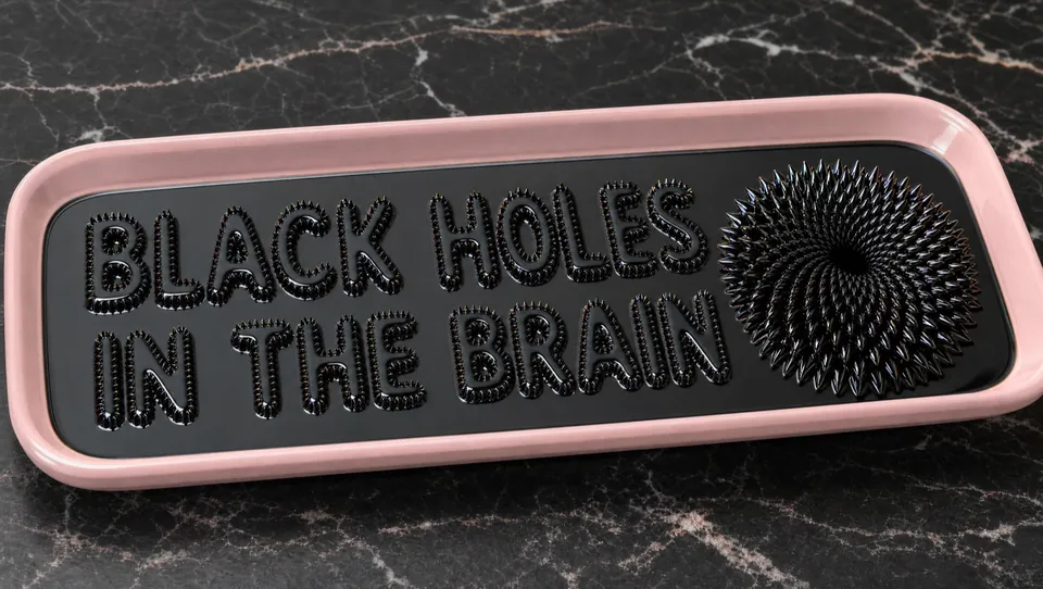 Title card raised in black ferrofluid in a pink tray